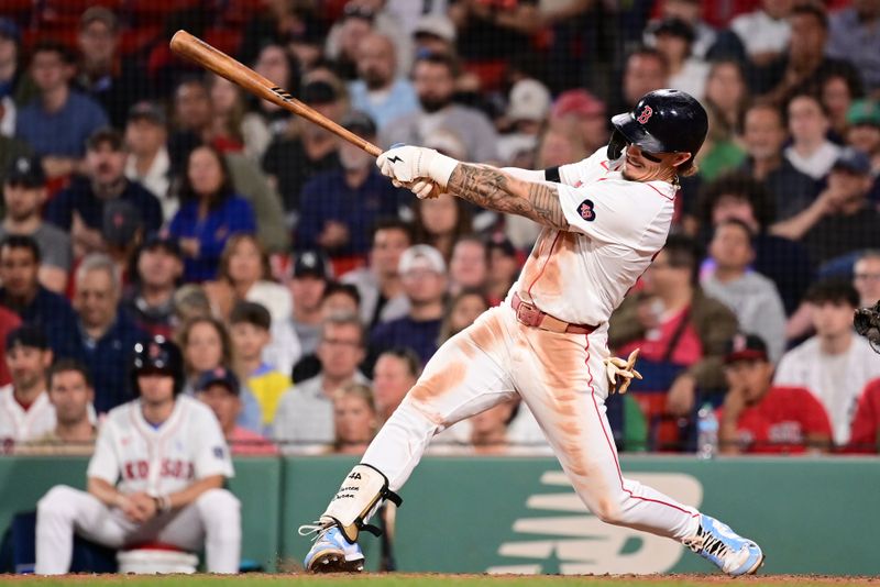 Jun 16, 2024; Boston, Massachusetts, USA; Boston Red Sox left fielder Jarren Duran (16) hits a single against the New York Yankees during the eighth inning at Fenway Park. Mandatory Credit: Eric Canha-USA TODAY Sports