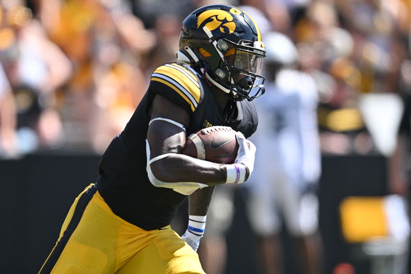 Sep 2, 2023; Iowa City, Iowa, USA; Iowa Hawkeyes running back Kaleb Johnson (2) runs the ball against the Utah State Aggies during the second quarter at Kinnick Stadium. Mandatory Credit: Jeffrey Becker-USA TODAY Sports