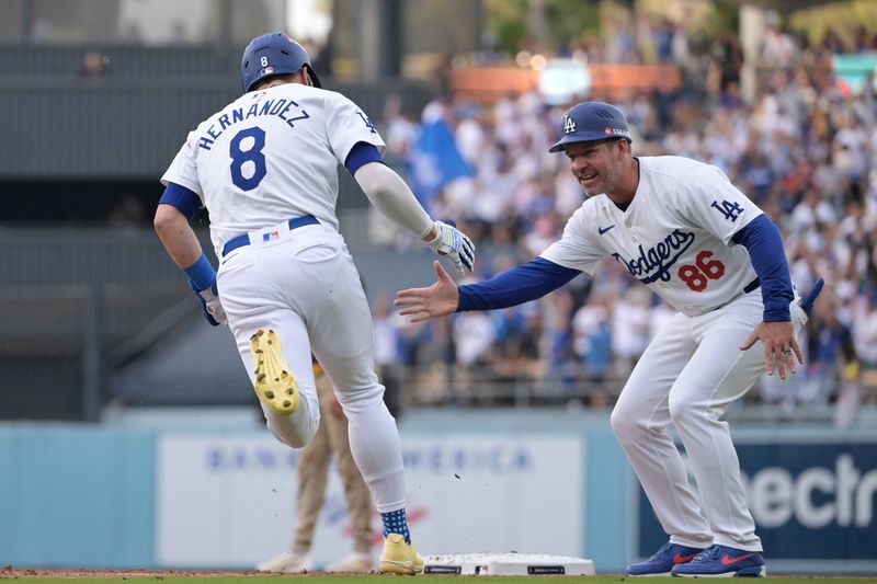 Oct 11, 2024; Los Angeles, California, USA; Los Angeles Dodgers third baseman Enrique Hernandez (8) celebrates with first base coach Clayton McCullough (86) after hitting a solo home run in the second inning against the San Diego Padres during game five of the NLDS for the 2024 MLB Playoffs at Dodger Stadium. Mandatory Credit: Jayne Kamin-Oncea-Imagn Images
