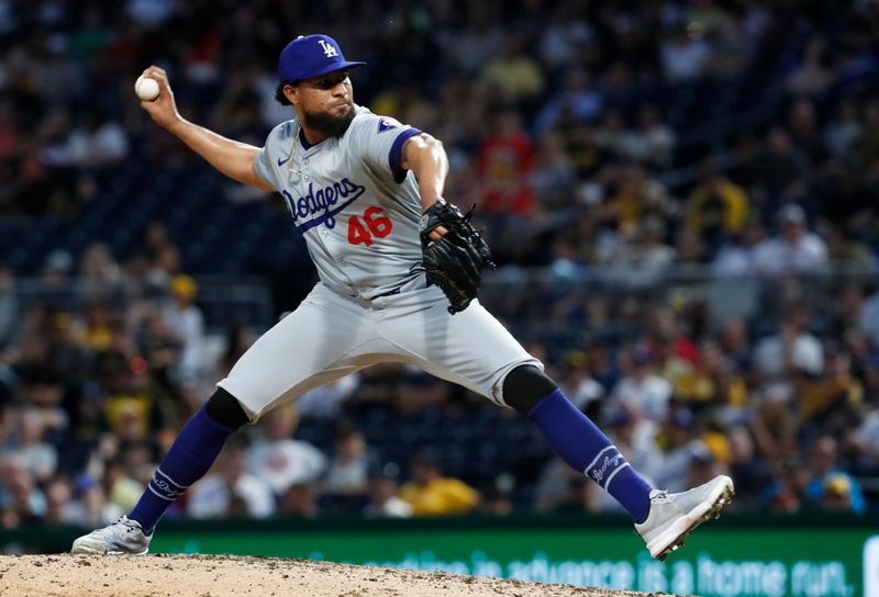 Jun 4, 2024; Pittsburgh, Pennsylvania, USA;  Los Angeles Dodgers relief pitcher Yohan Ramírez (46) pitches against the Pittsburgh Pirates during the eighth inning at PNC Park.The Pirates shutout the Dodgers 1-0.  Mandatory Credit: Charles LeClaire-USA TODAY Sports