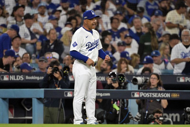Oct 11, 2024; Los Angeles, California, USA; Los Angeles Dodgers manager Dave Roberts (30) reacts in the eighth inning against the San Diego Padres during game five of the NLDS for the 2024 MLB Playoffs at Dodger Stadium. Mandatory Credit: Jayne Kamin-Oncea-Imagn Images