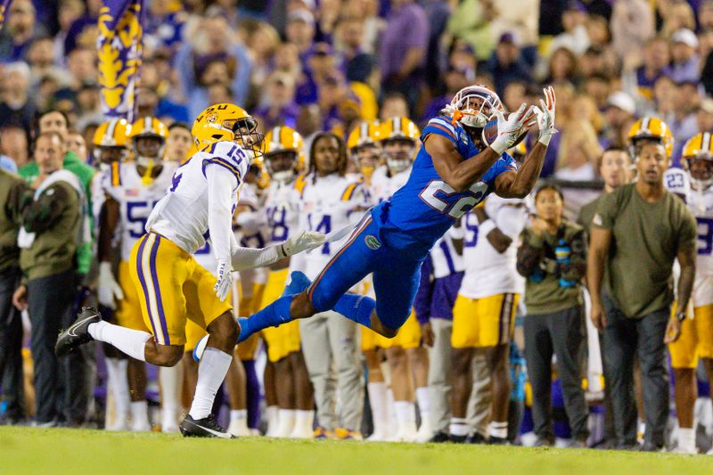 Nov 11, 2023; Baton Rouge, Louisiana, USA;  Florida Gators wide receiver Kahleil Jackson (22) catches a pass against LSU Tigers safety Sage Ryan (15) but it is ruled out of bounds during the second half at Tiger Stadium. Mandatory Credit: Stephen Lew-USA TODAY Sports