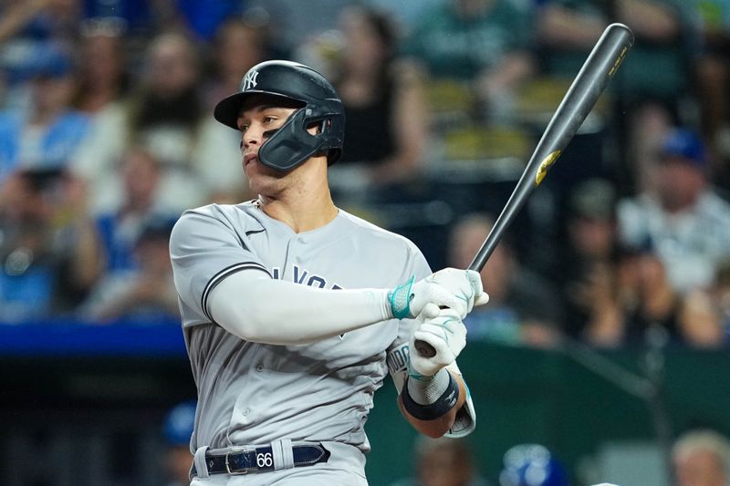 Sep 30, 2023; Kansas City, Missouri, USA; New York Yankees designated hitter Aaron Judge (99) hits a single during the fifth inning against the Kansas City Royals at Kauffman Stadium. Mandatory Credit: Jay Biggerstaff-USA TODAY Sports