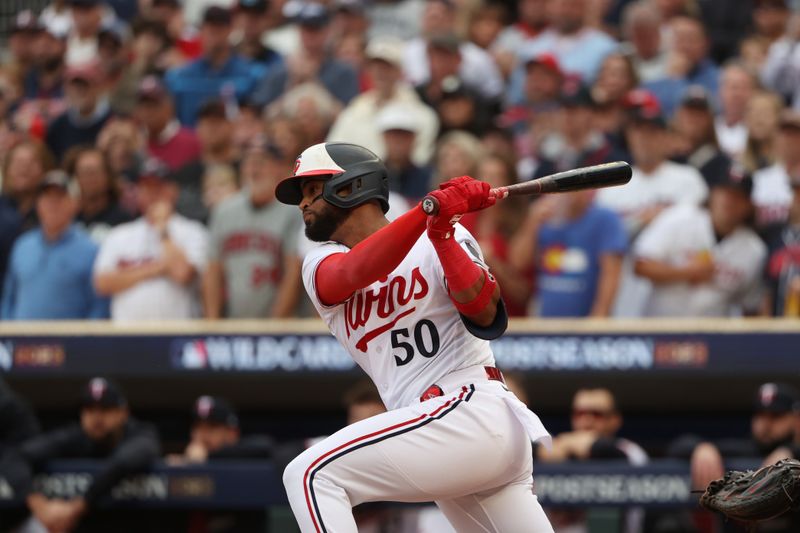 Oct 4, 2023; Minneapolis, Minnesota, USA; Minnesota Twins left fielder Willi Castro (50) gets a hit in the fourth inning against the Toronto Blue Jays during game two of the Wildcard series for the 2023 MLB playoffs at Target Field. Mandatory Credit: Jesse Johnson-USA TODAY Sports