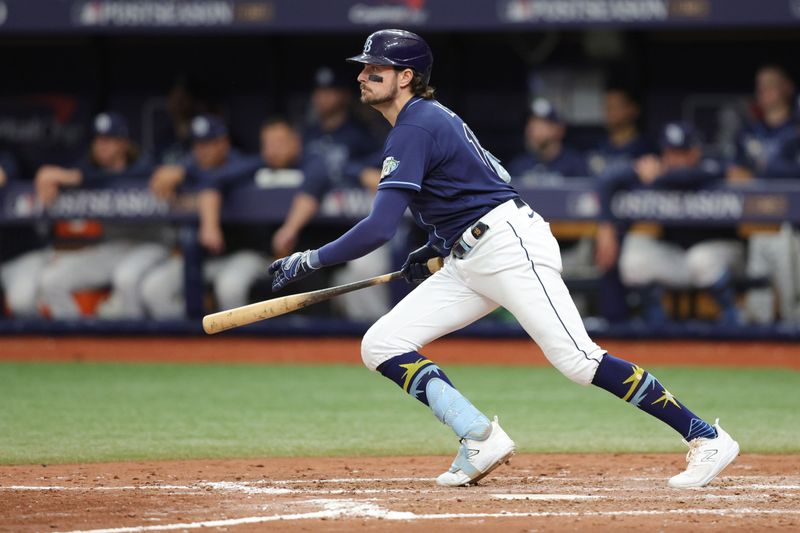 Oct 4, 2023; St. Petersburg, Florida, USA; Tampa Bay Rays right fielder Josh Lowe (15) hits a single against the Texas Rangers in the seventh inning during game two of the Wildcard series for the 2023 MLB playoffs at Tropicana Field. Mandatory Credit: Nathan Ray Seebeck-USA TODAY Sports