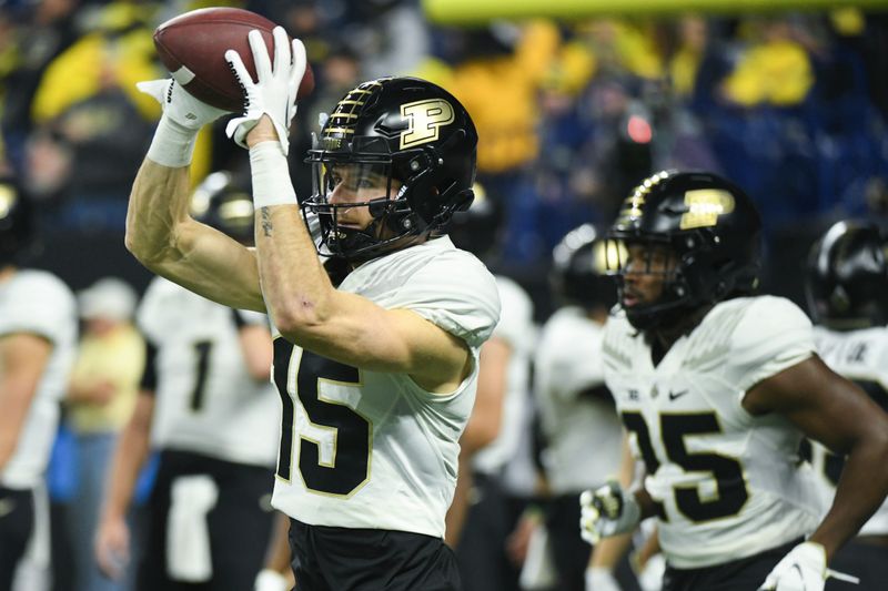 Dec 3, 2022; Indianapolis, Indiana, USA; Purdue Boilermakers wide receiver Charlie Jones (15) warms up before the Big Ten Championship against the Michigan Wolverines at Lucas Oil Stadium. Mandatory Credit: Robert Goddin-USA TODAY Sports