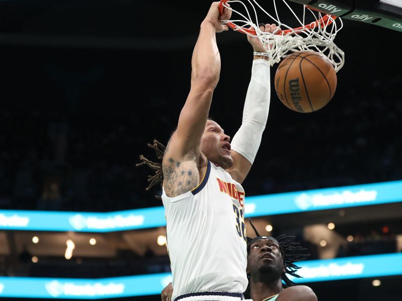 CHARLOTTE, NC - FEBRUARY 1: Aaron Gordon #32 of the Denver Nuggets dunks the ball during the game against the Charlotte Hornets on February 1, 2025 at Spectrum Center in Charlotte, North Carolina. NOTE TO USER: User expressly acknowledges and agrees that, by downloading and or using this photograph, User is consenting to the terms and conditions of the Getty Images License Agreement. Mandatory Copyright Notice: Copyright 2025 NBAE (Photo by Brock Williams-Smith/NBAE via Getty Images)