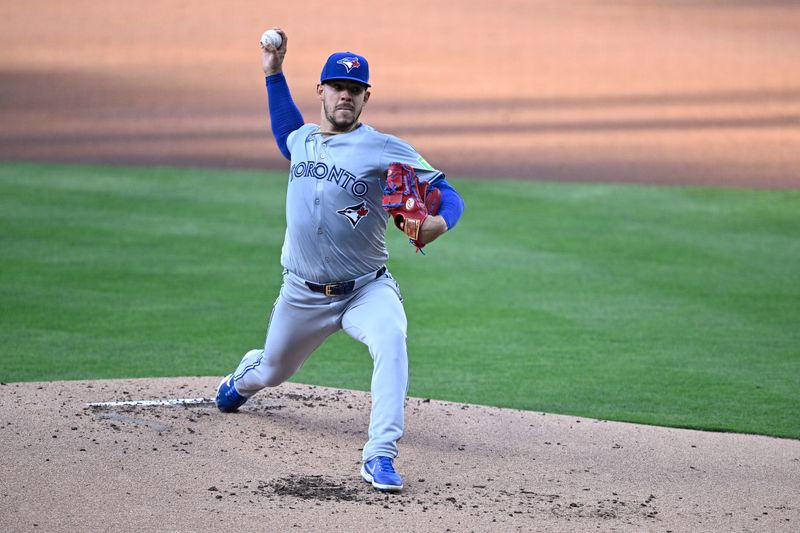 Apr 20, 2024; San Diego, California, USA; Toronto Blue Jays starting pitcher Jose Berrios (17) throws a pitch against the San Diego Padres during the first inning at Petco Park. Mandatory Credit: Orlando Ramirez-USA TODAY Sports