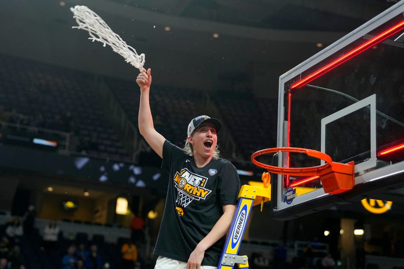 Apr 1, 2024; Albany, NY, USA; Iowa Hawkeyes guard Kate Martin (20) cuts the net after defeating the LSU Lady Tigers in the finals of the Albany Regional in the 2024 NCAA Tournament at MVP Arena. Mandatory Credit: Gregory Fisher-USA TODAY Sports