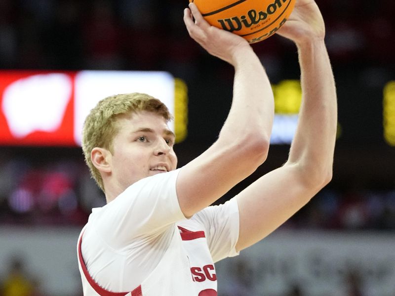 Jan 28, 2023; Madison, Wisconsin, USA;  Wisconsin Badgers forward Steven Crowl (22) shoots the ball during the second half against the Illinois Fighting Illini at the Kohl Center. Mandatory Credit: Kayla Wolf-USA TODAY Sports