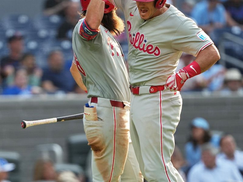 Sep 4, 2024; Toronto, Ontario, CAN; Philadelphia Phillies catcher J.T. Realmuto (10) hits a home run and celebrates with left fielder Brandon Marsh (16) against the Toronto Blue Jays during the ninth inning at Rogers Centre. Mandatory Credit: Nick Turchiaro-Imagn Images