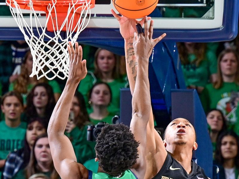 Jan 17, 2023; South Bend, Indiana, USA; Florida State Seminoles guard Matthew Cleveland (35) blocks the shot attempt by Notre Dame Fighting Irish guard Trey Wertz (3) in the first half at the Purcell Pavilion. Mandatory Credit: Matt Cashore-USA TODAY Sports