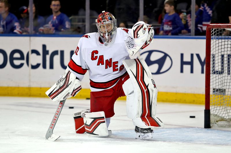 Jan 2, 2024; New York, New York, USA; Carolina Hurricanes goalie Antti Raanta (32) makes a save during warmups before the first period against the New York Rangers at Madison Square Garden. Mandatory Credit: Danny Wild-USA TODAY Sports