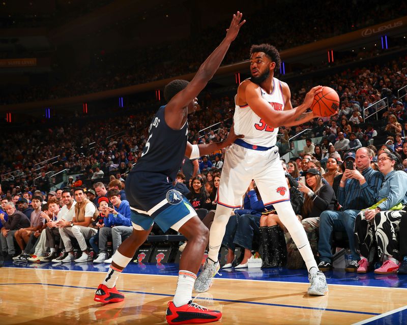 NEW YORK, NY - OCTOBER 13: Karl-Anthony Towns #32 of the New York Knicks looks to pass the ball during the game on October 13, 2024 at Madison Square Garden in New York City, New York.  NOTE TO USER: User expressly acknowledges and agrees that, by downloading and or using this photograph, User is consenting to the terms and conditions of the Getty Images License Agreement. Mandatory Copyright Notice: Copyright 2024 NBAE  (Photo by David L. Nemec/NBAE via Getty Images)