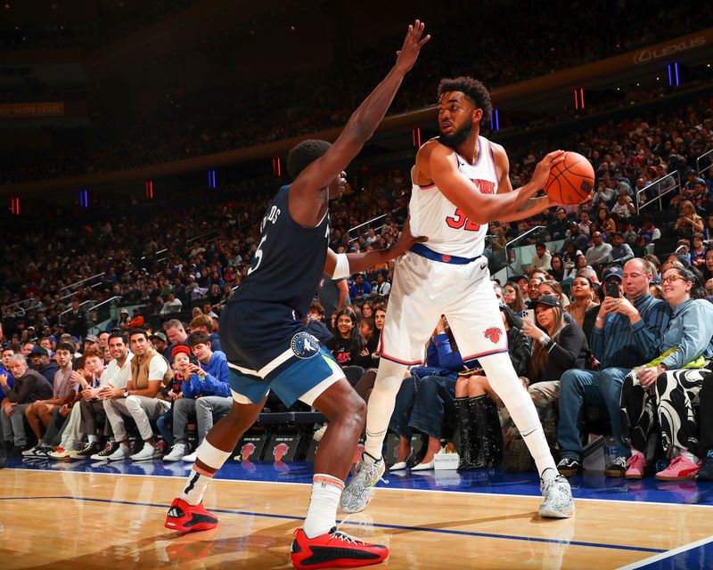 NEW YORK, NY - OCTOBER 13: Karl-Anthony Towns #32 of the New York Knicks looks to pass the ball during the game on October 13, 2024 at Madison Square Garden in New York City, New York.  NOTE TO USER: User expressly acknowledges and agrees that, by downloading and or using this photograph, User is consenting to the terms and conditions of the Getty Images License Agreement. Mandatory Copyright Notice: Copyright 2024 NBAE  (Photo by David L. Nemec/NBAE via Getty Images)