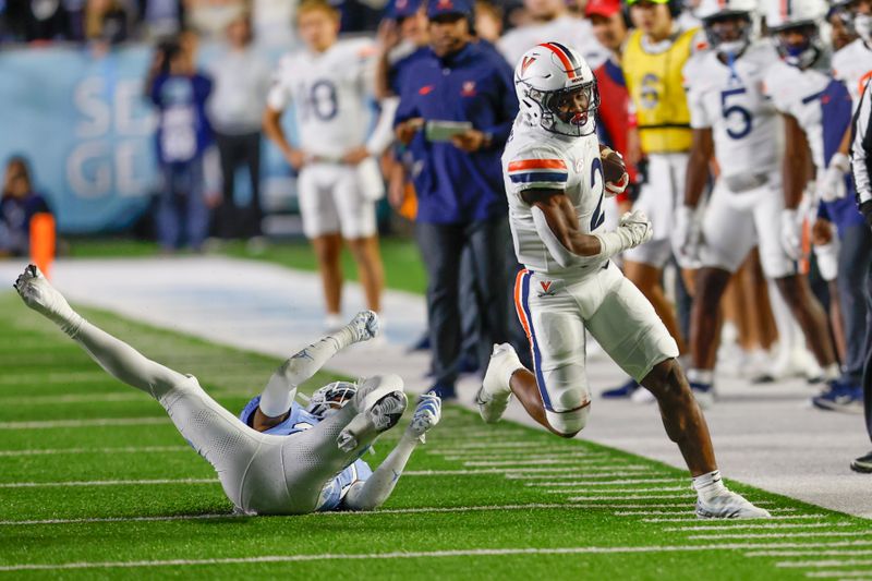 Oct 21, 2023; Chapel Hill, North Carolina, USA; Virginia Cavaliers running back Perris Jones (2) runs after a catch against the North Carolina Tar Heels in the first half at Kenan Memorial Stadium. Mandatory Credit: Nell Redmond-USA TODAY Sports