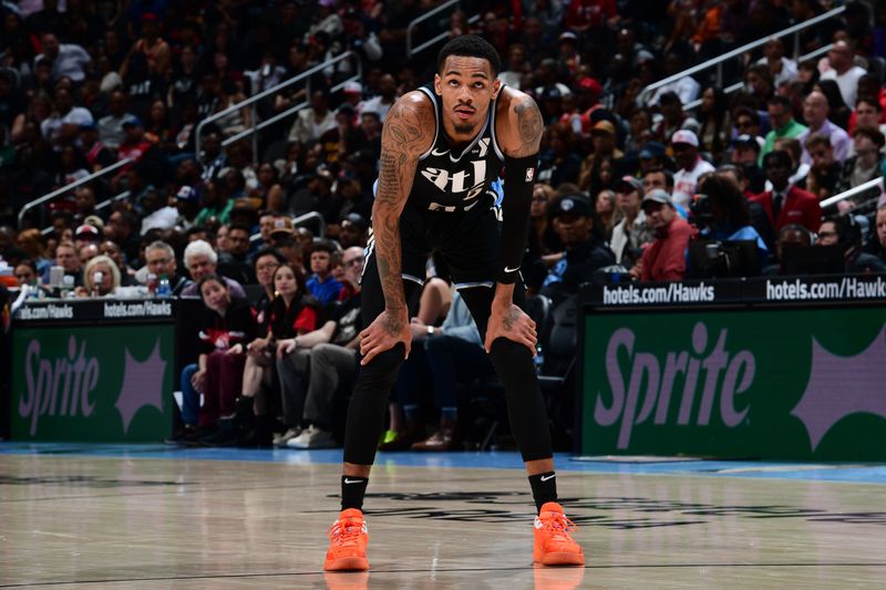 ATLANTA, GA - MARCH 30: Dejounte Murray #5 of the Atlanta Hawks looks on during the game against the Milwaukee Bucks on March 30, 2024 at State Farm Arena in Atlanta, Georgia.  NOTE TO USER: User expressly acknowledges and agrees that, by downloading and/or using this Photograph, user is consenting to the terms and conditions of the Getty Images License Agreement. Mandatory Copyright Notice: Copyright 2024 NBAE (Photo by Scott Cunningham/NBAE via Getty Images)