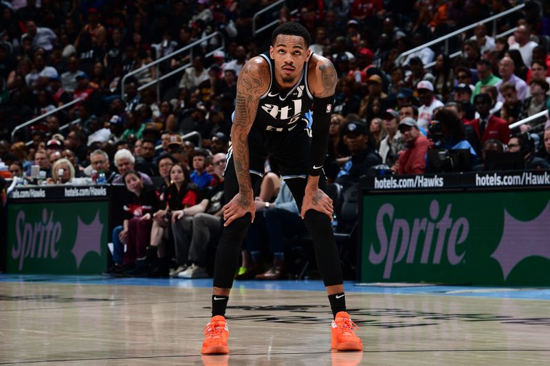 ATLANTA, GA - MARCH 30: Dejounte Murray #5 of the Atlanta Hawks looks on during the game against the Milwaukee Bucks on March 30, 2024 at State Farm Arena in Atlanta, Georgia.  NOTE TO USER: User expressly acknowledges and agrees that, by downloading and/or using this Photograph, user is consenting to the terms and conditions of the Getty Images License Agreement. Mandatory Copyright Notice: Copyright 2024 NBAE (Photo by Scott Cunningham/NBAE via Getty Images)