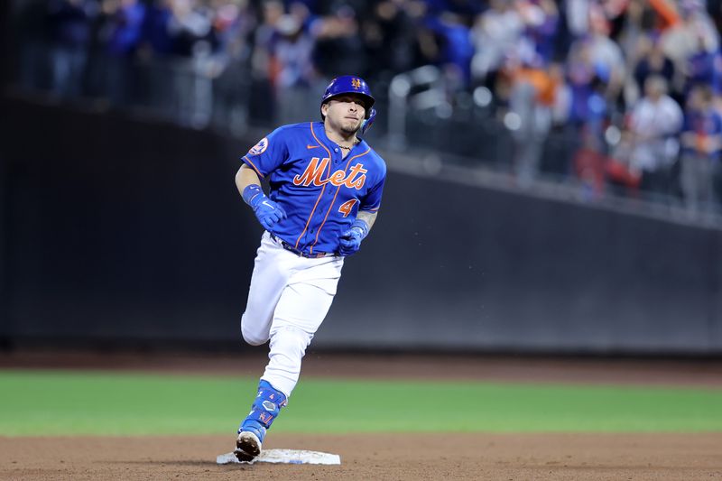 Sep 30, 2023; New York City, New York, USA; New York Mets catcher Francisco Alvarez (4) rounds the bases after hitting a grand slam home run against the Philadelphia Phillies during the third inning at Citi Field. Mandatory Credit: Brad Penner-USA TODAY Sports