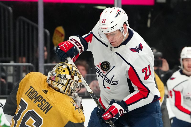 Dec 2, 2023; Las Vegas, Nevada, USA; Vegas Golden Knights goaltender Logan Thompson (36) deflects the puck into the chest of Washington Capitals center Aliaksei Protas (21)  during the first period at T-Mobile Arena. Mandatory Credit: Stephen R. Sylvanie-USA TODAY Sports