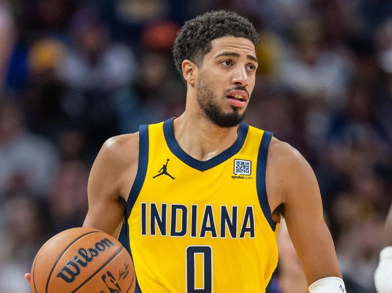 INDIANAPOLIS, INDIANA - NOVEMBER 10: Tyrese Haliburton #0 of the Indiana Pacers brings the ball up court during the game against the New York Knicks at Gainbridge Fieldhouse on November 10, 2024 in Indianapolis, Indiana. NOTE TO USER: User expressly acknowledges and agrees that, by downloading and or using this photograph, User is consenting to the terms and conditions of the Getty Images License Agreement. (Photo by Michael Hickey/Getty Images)