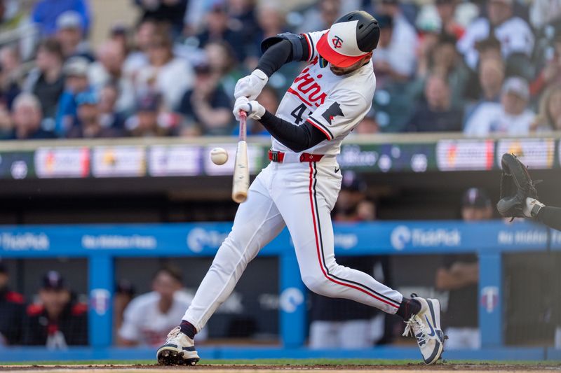 Apr 23, 2025; Minneapolis, Minnesota, USA; Minnesota Twins designated hitter Edouard Julien (47) singles off a pitch from Chicago White Sox starting pitcher Bryse Wilson (46) in the first inning at Target Field. Mandatory Credit: Matt Blewett-Imagn Images