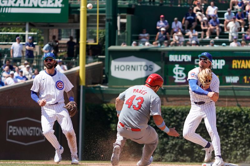 Jun 16, 2024; Chicago, Illinois, USA; Chicago Cubs second base Nico Hoerner (2) forces out St. Louis Cardinals catcher Pedro Pagés (43) at second baseman during the eighth inning at Wrigley Field. Mandatory Credit: David Banks-USA TODAY Sports