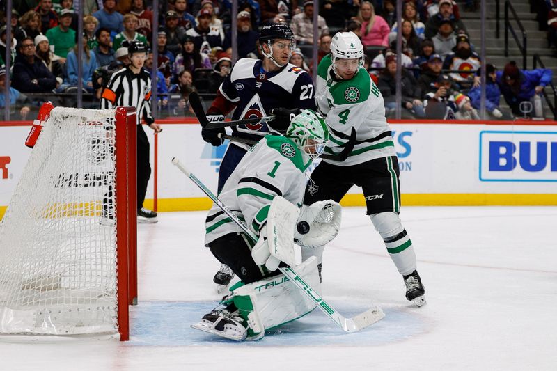 Jan 18, 2025; Denver, Colorado, USA; Dallas Stars goaltender Casey DeSmith (1) makes a save ahead of Colorado Avalanche left wing Jonathan Drouin (27) and defenseman Miro Heiskanen (4) in the second period at Ball Arena. Mandatory Credit: Isaiah J. Downing-Imagn Images