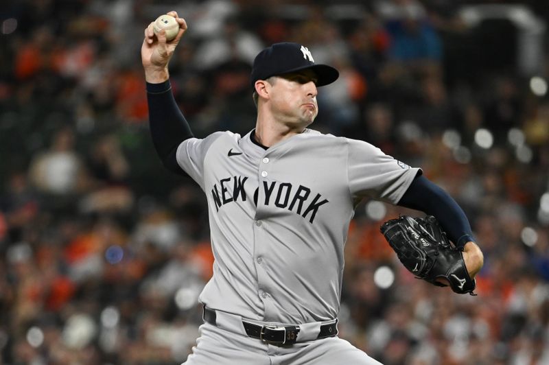 May 1, 2024; Baltimore, Maryland, USA;  New York Yankees pitcher Clay Holmes (35) throws a eighth inning pitch against the Baltimore Orioles at Oriole Park at Camden Yards. Mandatory Credit: Tommy Gilligan-USA TODAY Sports