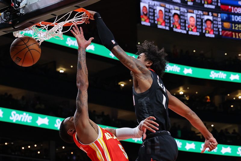 ATLANTA, GEORGIA - FEBRUARY 10:  Jalen Green #4 of the Houston Rockets dunks against Dejounte Murray #5 of the Atlanta Hawks during the fourth quarter at State Farm Arena on February 10, 2024 in Atlanta, Georgia.  NOTE TO USER: User expressly acknowledges and agrees that, by downloading and/or using this photograph, user is consenting to the terms and conditions of the Getty Images License Agreement.  (Photo by Kevin C. Cox/Getty Images)