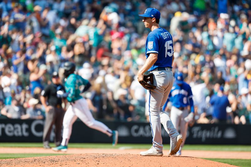 Aug 28, 2023; Seattle, Washington, USA; Kansas City Royals relief pitcher Matt Duffy (15) stands on the mound after surrendering a solo-home run to Seattle Mariners right fielder Teoscar Hernandez (35, background during the eighth inning at T-Mobile Park. Mandatory Credit: Joe Nicholson-USA TODAY Sports