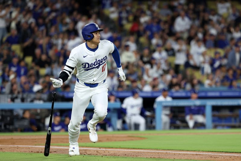 Sep 11, 2024; Los Angeles, California, USA;  Los Angeles Dodgers designated hitter Shohei Ohtani (17) hits a home run during the first inning against the Chicago Cubs at Dodger Stadium. Mandatory Credit: Kiyoshi Mio-Imagn Images