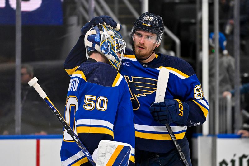 Dec 14, 2023; St. Louis, Missouri, USA;  St. Louis Blues left wing Pavel Buchnevich (89) and goaltender Jordan Binnington (50) celebrate after the Blues defeated the Ottawa Senators at Enterprise Center. Mandatory Credit: Jeff Curry-USA TODAY Sports