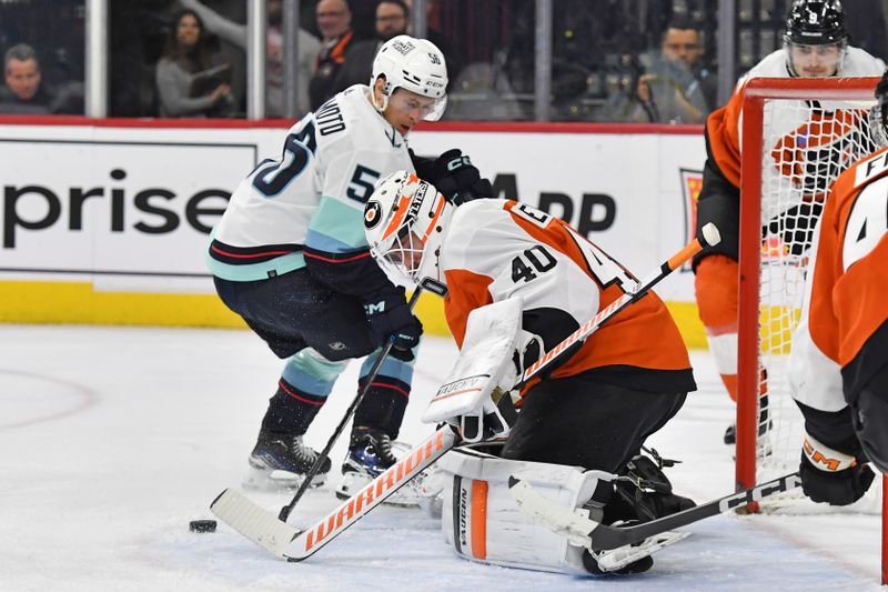 Feb 10, 2024; Philadelphia, Pennsylvania, USA; Philadelphia Flyers goaltender Cal Petersen (40) makes a save against Seattle Kraken right wing Kailer Yamamoto (56) during the second period at Wells Fargo Center. Mandatory Credit: Eric Hartline-USA TODAY Sports