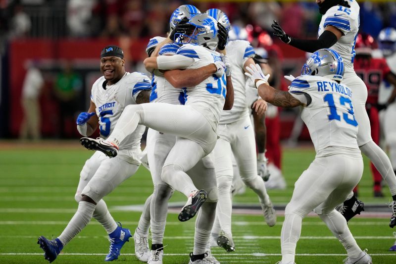 Detroit Lions place kicker Jake Bates (39) celebrates with teammates after kicking a 52-yard field goal at the end of an NFL football game against the Houston Texans, Sunday, Nov. 10, 2024, in Houston. The Lions won 26-23. (AP Photo/David J. Phillip)