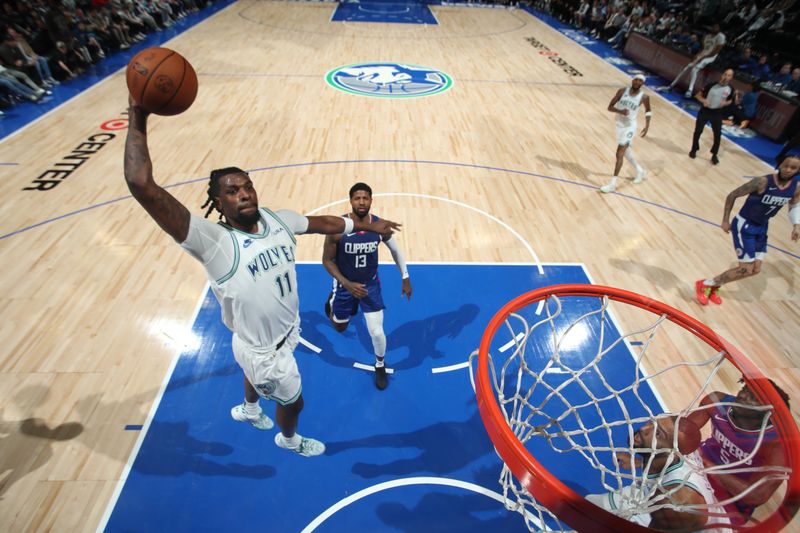 MINNEAPOLIS, MN -  MARCH 3: Naz Reid #11 of the Minnesota Timberwolves drives to the basket during the game against the LA Clippers on March 3, 2024 at Target Center in Minneapolis, Minnesota. NOTE TO USER: User expressly acknowledges and agrees that, by downloading and or using this Photograph, user is consenting to the terms and conditions of the Getty Images License Agreement. Mandatory Copyright Notice: Copyright 2024 NBAE (Photo by Jordan Johnson/NBAE via Getty Images)