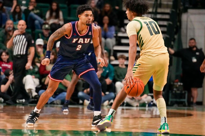 Jan 6, 2024; Charlotte, North Carolina, USA; Florida Atlantic Owls guard Nicholas Boyd (2) back on defense against Charlotte 49ers guard Nik Graves (10) during the second half at Dale F. Halton Arena. Mandatory Credit: Jim Dedmon-USA TODAY Sports