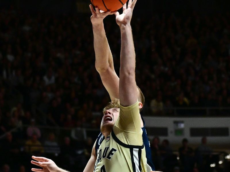 Jan 10, 2026; West Lafayette, Indiana, USA; Purdue Boilermakers guard Jack Benter (14) jumps for a rebound during the first half against the Penn State Nittany Lions at Mackey Arena. Mandatory Credit: Marc Lebryk-Imagn Images