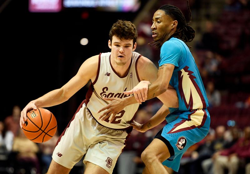 Feb 18, 2023; Tallahassee, Florida, USA; Boston College Eagles forward Quinten Post (12) works the ball around Florida State Seminoles guard Caleb Mills (4) during the second half at Donald L. Tucker Center. Mandatory Credit: Melina Myers-USA TODAY Sports