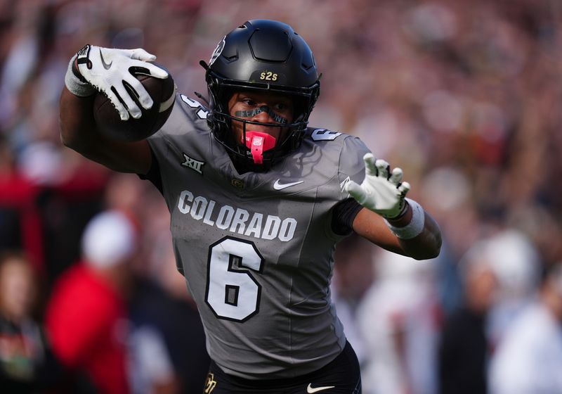 Nov 16, 2024; Boulder, Colorado, USA; Colorado Buffaloes wide receiver Drelon Miller (6) carries for a touchdown in the fourth quarter against the Utah Utes at Folsom Field. Mandatory Credit: Ron Chenoy-Imagn Images