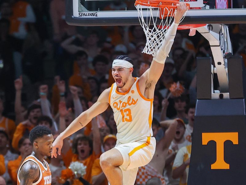 Jan 28, 2023; Knoxville, Tennessee, USA; Tennessee Volunteers forward Olivier Nkamhoua (13) dunks the ball against the Texas Longhorns during the second half at Thompson-Boling Arena. Mandatory Credit: Randy Sartin-USA TODAY Sports