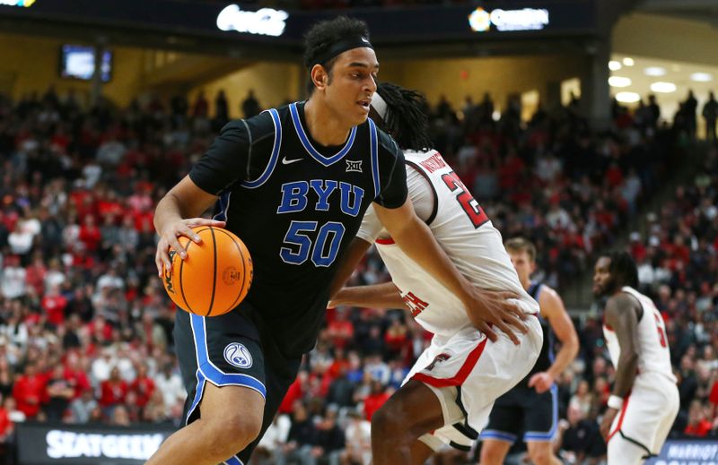 Jan 20, 2024; Lubbock, Texas, USA;  Brigham Young Cougars center Aly Khalifa (50) drives the ball around Texas Tech Red Raiders forward Warren Washington (22) in the second half at United Supermarkets Arena. Mandatory Credit: Michael C. Johnson-USA TODAY Sports