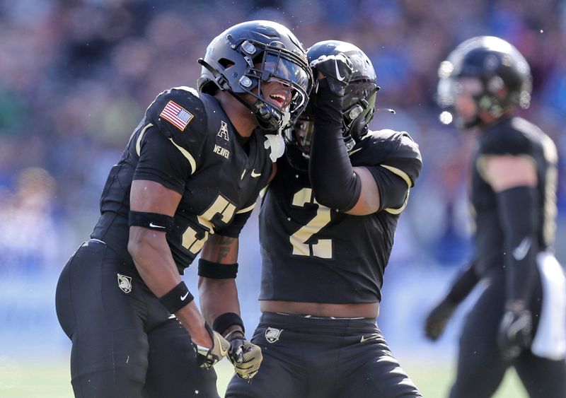 Nov 2, 2024; West Point, New York, USA; Army Black Knights cornerback Justin Weaver (5) celebrates a tackle against the Air Force Falcons during the first half at Michie Stadium. Mandatory Credit: Danny Wild-Imagn Images