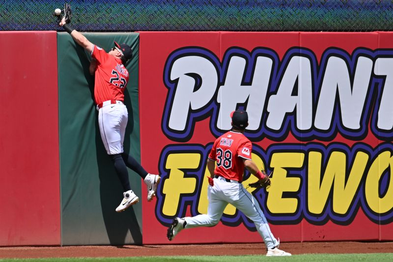 May 14, 2025; Cleveland, Ohio, USA; Cleveland Guardians center fielder Nolan Jones (22) fails to catch a ball hit by Milwaukee Brewers left fielder Jake Bauers (9) during the second inning at Progressive Field. Mandatory Credit: Ken Blaze-Imagn Images