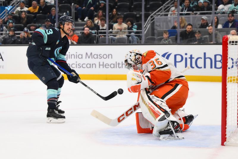 Nov 27, 2024; Seattle, Washington, USA; Anaheim Ducks goaltender John Gibson (36) blocks a goal shot by Seattle Kraken left wing Brandon Tanev (13) during the first period at Climate Pledge Arena. Mandatory Credit: Steven Bisig-Imagn Images