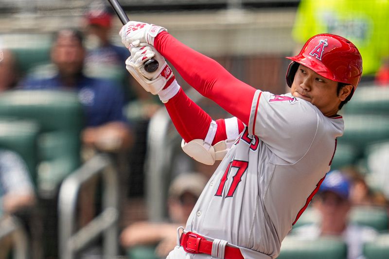 Aug 2, 2023; Cumberland, Georgia, USA; Los Angeles Angels designated hitter Shohei Ohtani (17) singles against the Atlanta Braves during the sixth inning at Truist Park. Mandatory Credit: Dale Zanine-USA TODAY Sports