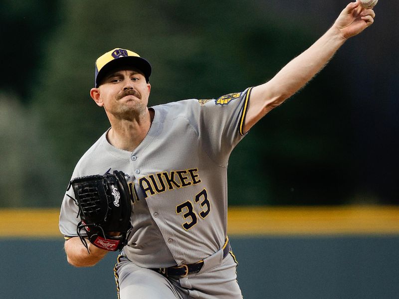 Apr 9, 2025; Denver, Colorado, USA; Milwaukee Brewers starting pitcher Tyler Alexander (33) pitches in the first inning against the Colorado Rockies at Coors Field. Mandatory Credit: Isaiah J. Downing-Imagn Images