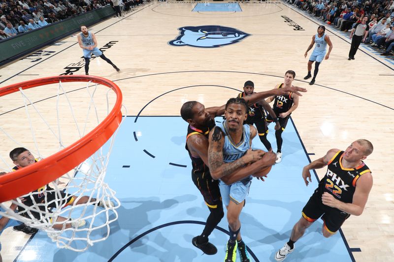 MEMPHIS, TN - MARCH 10: Ja Morant #12 of the Memphis Grizzlies drives to the basket during the game against the Phoenix Suns on March 10, 2025 at FedExForum in Memphis, Tennessee. NOTE TO USER: User expressly acknowledges and agrees that, by downloading and or using this photograph, User is consenting to the terms and conditions of the Getty Images License Agreement. Mandatory Copyright Notice: Copyright 2025 NBAE (Photo by Joe Murphy/NBAE via Getty Images)