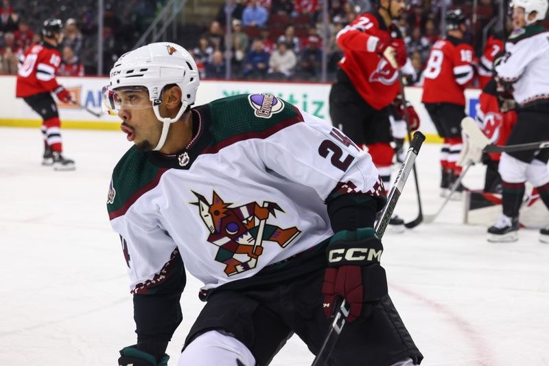 Oct 13, 2023; Newark, New Jersey, USA; Arizona Coyotes defenseman Matt Dumba (24) celebrates his goal against the New Jersey Devils during the first period at Prudential Center. Mandatory Credit: Ed Mulholland-USA TODAY Sports