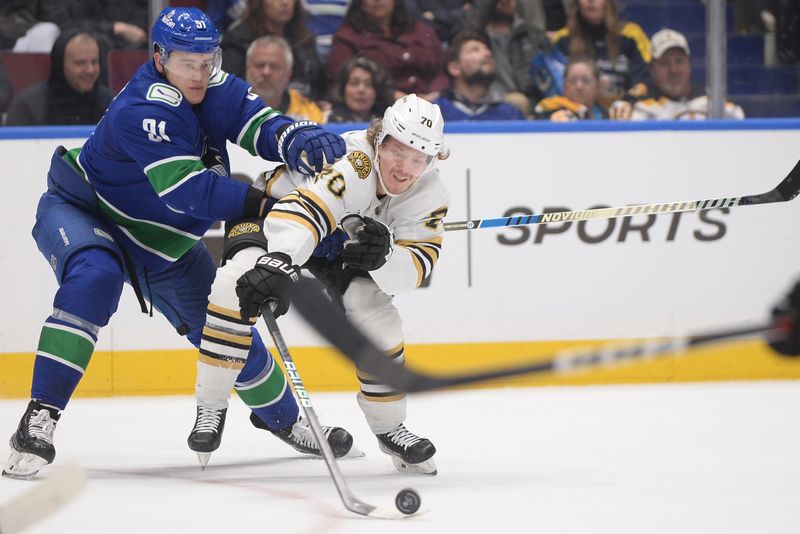 Feb 24, 2024; Vancouver, British Columbia, CAN;  Vancouver Canucks player Nikita Zadorov (91) reaches across Boston Bruins forward Jesper Boqvist (70) during the second period at Rogers Arena. Mandatory Credit: Anne-Marie Sorvin-USA TODAY Sports